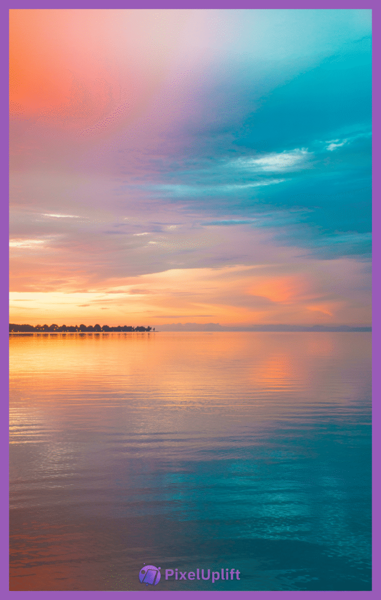 Serene sunset over calm water with gradient sky and tree-lined shore silhouette